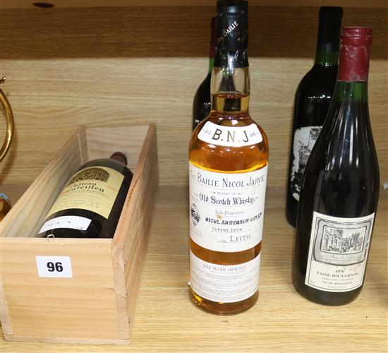 Four assorted wines and a bottle of whisky